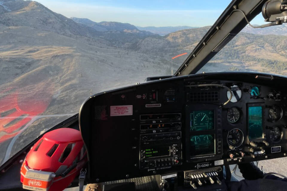 Sx Penticton search and rescue specialists and a Topflight helicopter had the difficult task of recovering the body of a hiker on McIntyre Bluffs in OK Falls. (Penticton & District Search & Rescue photo)