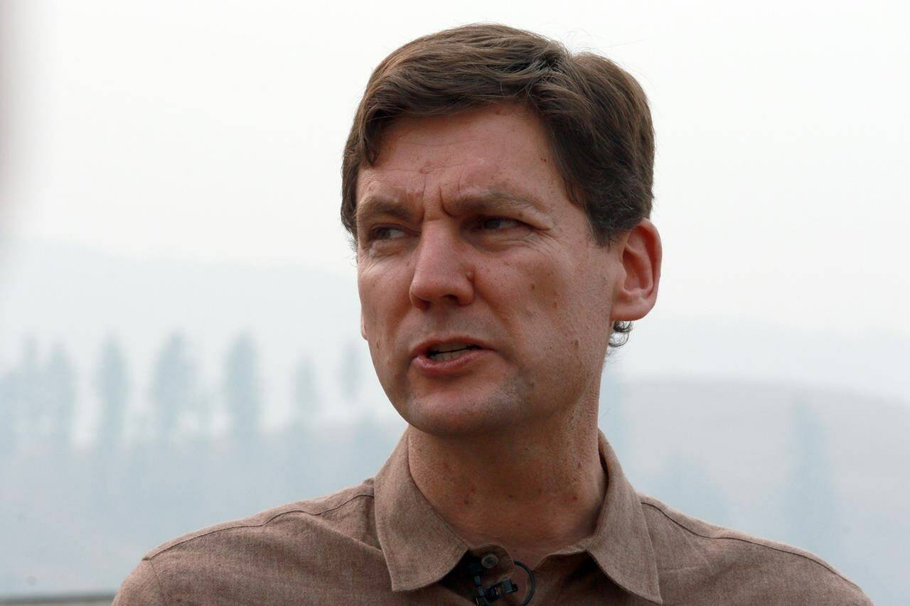 British Columbia Premier David Eby is calling on the Bank of Canada to halt further interest rate hikes. Eby speaks to media following a tour of the Tselletkwe Lodge in Kamloops, B.C., Tuesday, Aug. 22, 2023. THE CANADIAN PRESS/Chad Hipolito