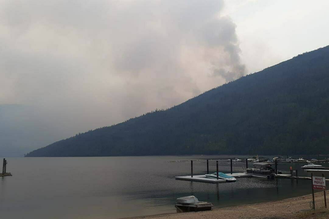 Smoke rises from the Bush Creek East wildfire in an undated handout photo. Residents of one of the regions most devastated by wildfires in British Columbia will be touring the burned-out site today.THE CANADIAN PRESS/HO-B.C. Wildfire Service