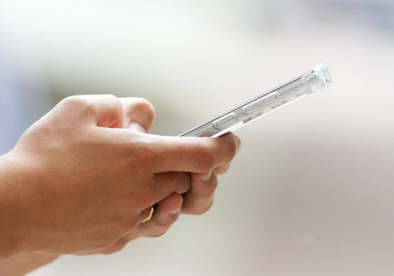 Some local high school students have been banned from using phones at school. THE CANADIAN PRESS/Sean Kilpatrick