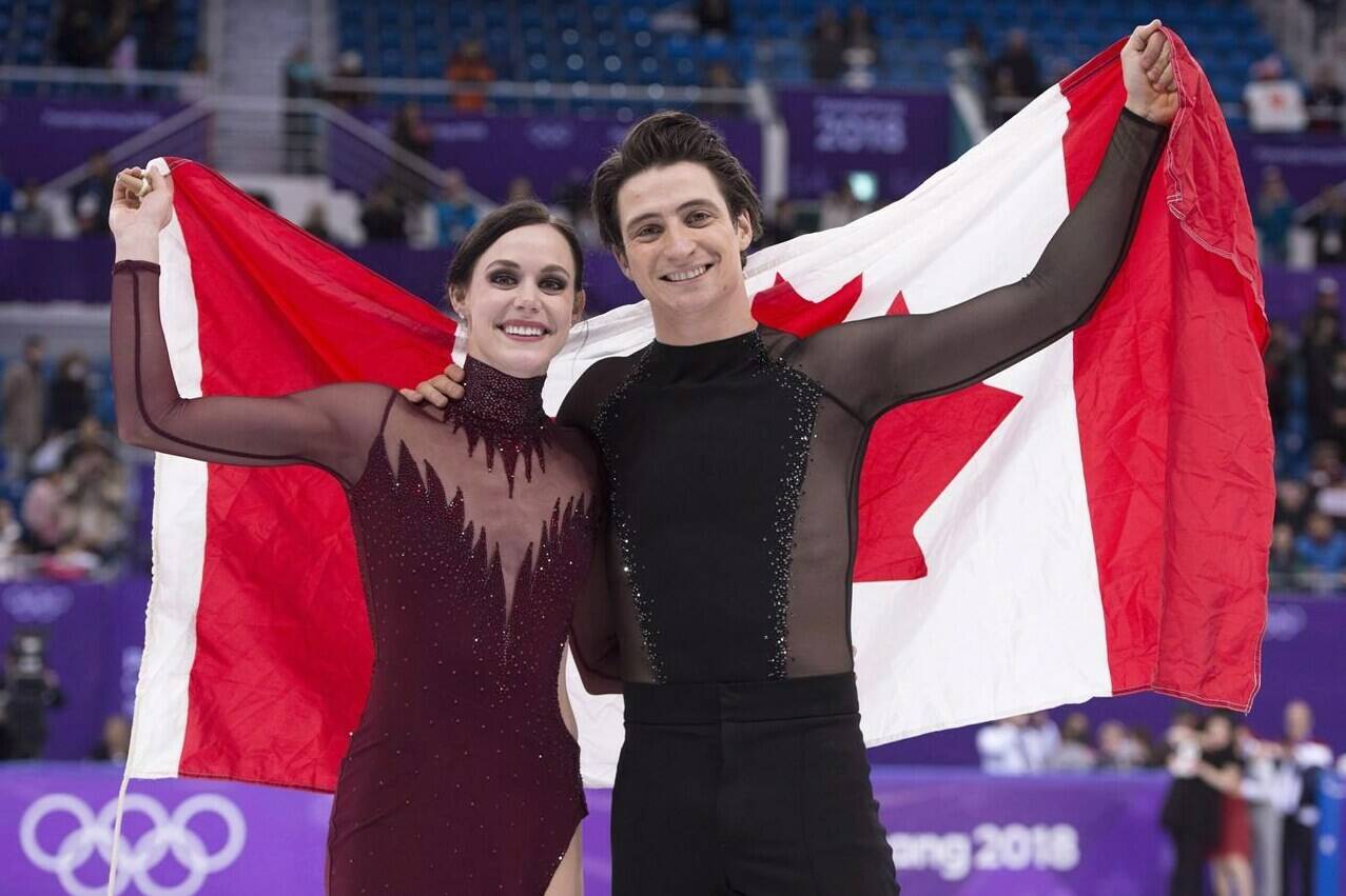 Decorated ice dance duo Tessa Virtue and Scott Moir are among the 2023 inductees into Canada’s Sports Hall of Fame. The Ice dance gold medallists hold up the Canadian flag during victory ceremonies at the Pyeongchang Winter Olympics Tuesday, February 20, 2018 in Gangneung, South Korea. THE CANADIAN PRESS/Paul Chiasson