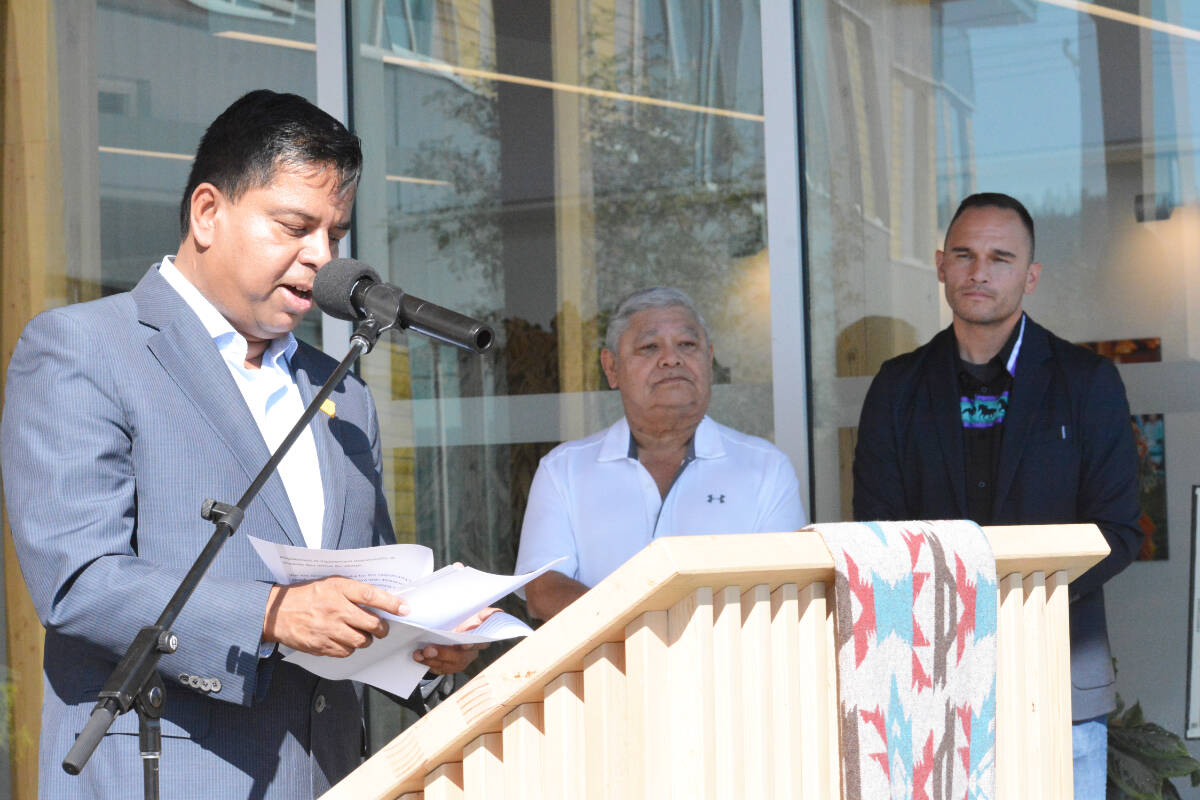 Federal Minister of Crown-Indigenous Affairs, Gary Anandasangaree, delivers an apology on behalf of Canada to Williams Lake First Nation Sunday, Sept. 10 while WLFN Coun. Chris Wycotte and Chief Willie Sellars look on. (Monica Lamb-Yorski photo - Williams Lake Tribune)