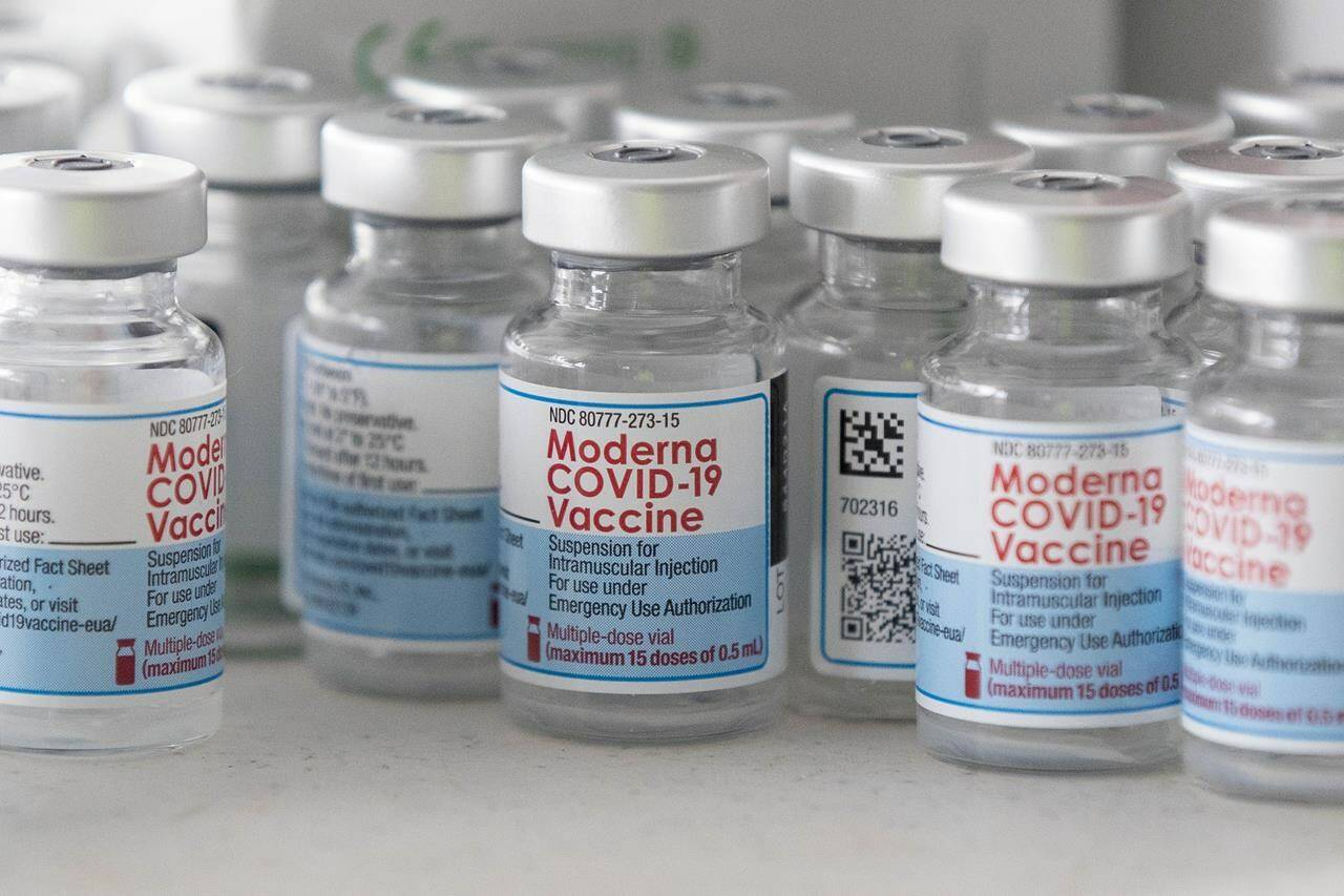 Health Canada has authorized the use of an updated Moderna vaccine for COVID-19 for all Canadians over the age of six months. Empty Moderna vaccine vials are shown before a COVID-19 vaccine drive-thru clinic at Richardson stadium in Kingston, Ont., on Friday, Jul. 2, 2021. THE CANADIAN PRESS/Lars Hagberg