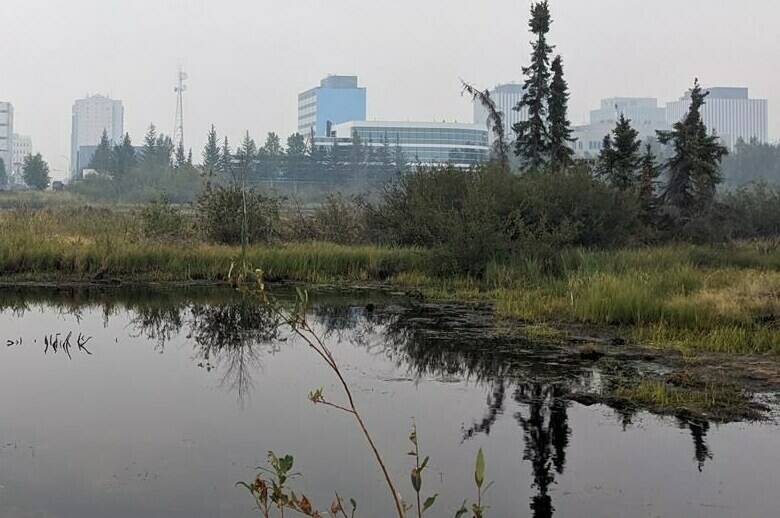 It remains unclear when residents in the Northwest Territories’ South Slave region will be allowed to return home, but officials are set to open pre-registration for re-entry flights in anticipation. Wildfire smoke fills the air over Yellowknife, Thursday, Aug. 17, 2023. THE CANADIAN PRESS/Bill Braden