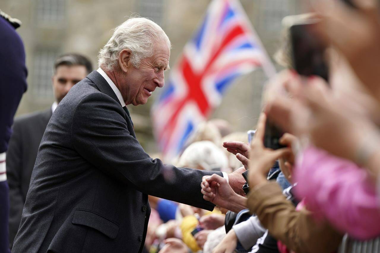 FILE - Britain’s King Charles III meets members of the public during his visit to Kinneil House in Edinburgh, Scotland, Monday, July 3, 2023. Two months after the lavish coronation of King Charles III at Westminster Abbey in London, Scotland is set to host its own event to mark the new monarch’s accession to the throne. While Charles won’t have a separate coronation Wednesday in Edinburgh, the festivities will include a crown, horse-drawn carriages, mounted cavalry and a flyover by the Red Arrows, the Royal Air Force’s aerobatic display team, as Scotland celebrates its unique relationship with the monarchy. (Andrew Milligan/Pool Photo via AP, File)