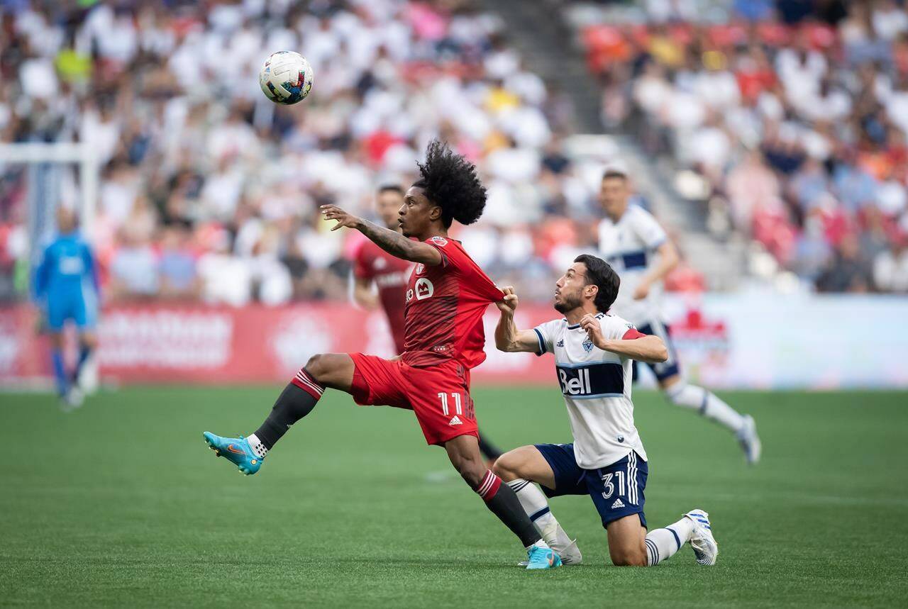 Toronto FC hosts the Vancouver Whitecaps on Saturday as both teams return to action after the international break. Toronto FC’s Jayden Nelson (11) and Vancouver Whitecaps’ Russell Teibert (31) vie for the ball during the first half of the Canadian Championship soccer final, in Vancouver, on Tuesday, July 26, 2022. THE CANADIAN PRESS/Darryl Dyck