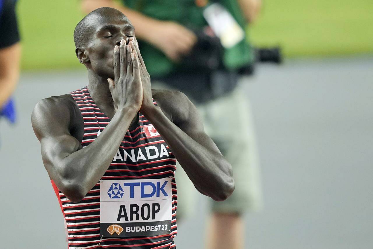 <div>Canada’s Marco Arop set a national record and personal best in a second-place finish in the men’s 800 metres at the Diamond League final on Sunday. Arop celebrates winning the gold medal ahead in the Men’s 800-meters final during the World Athletics Championships in Budapest, Hungary, Saturday, Aug. 26, 2023. THE CANADIAN PRESS/AP-Martin Meissner</div>