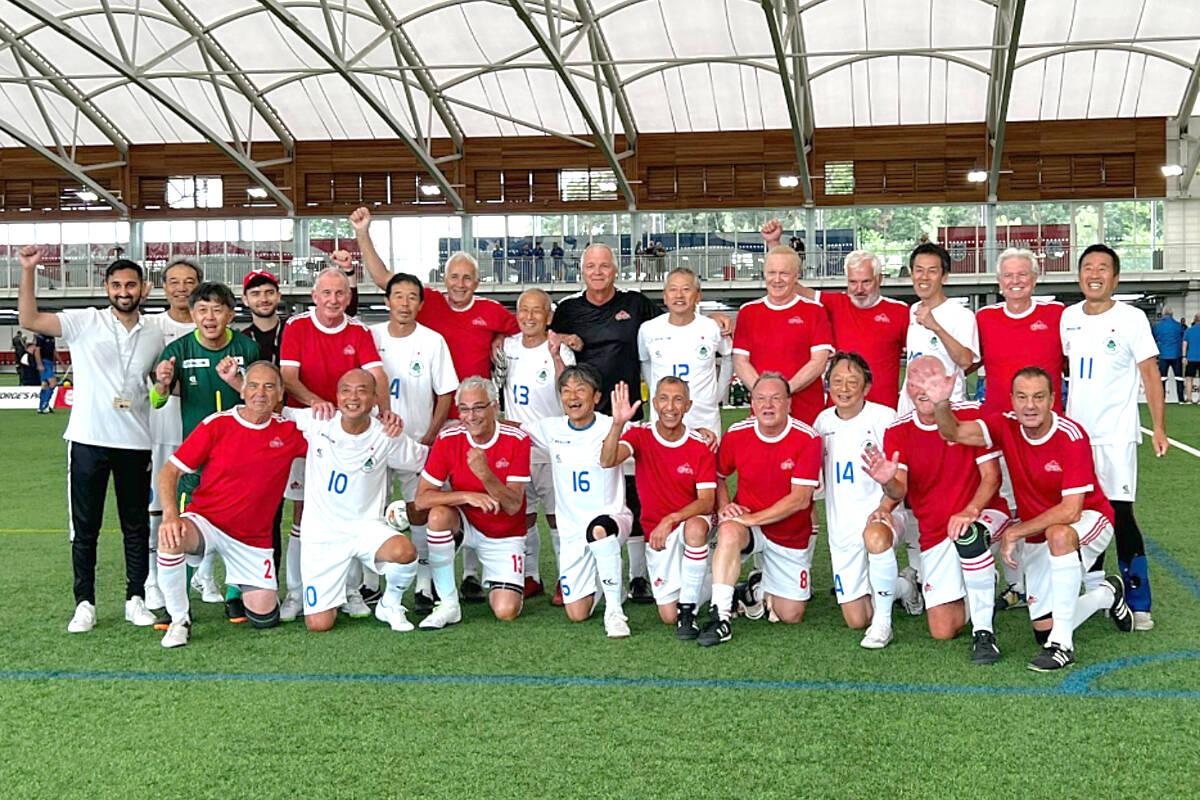 Team Canada posed for a photo with members of the Japanese team after beating them 3-2 in the round-robin of the inaugural Walking Football World Nations Cup in England. Third from the left in the front row is Parksville player Rob Jonas. (Submitted photo)(Submitted photo)