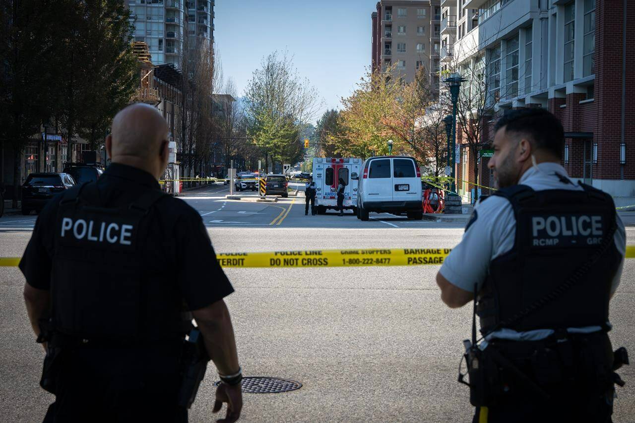 A police road block is seen on Glen Drive after a shooting involving RCMP officers in Coquitlam B.C. on Friday, September 22, 2023. The death of a Metro Vancouver RCMP officer who was shot dead while executing a search warrant is reverberating with law enforcement officials across the country. THE CANADIAN PRESS/Ethan Cairns