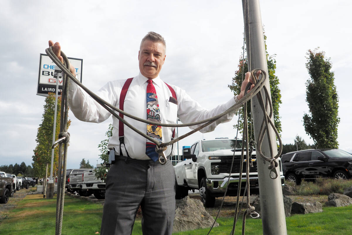 Ross Barnard, general sales manager of Laird Wheaton Chevrolet Buick GMC, came to work Monday, Sept. 25, to discover someone had made off with one of the dealership’s giant Canada flags, which have flown above the intersection for several decades. (Chris Bush/News Bulletin)
