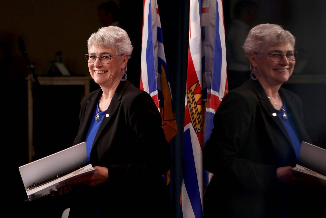 British Columbia's projected deficit in the 2023-2024 fiscal year has grown by more than $2 billion from original estimates to reach almost $7 billion. Minister of Finance Katrine Conroy arrives to the podium during a press conference at the legislature in Victoria, on Wednesday, August 30, 2023. THE CANADIAN PRESS/Chad Hipolito