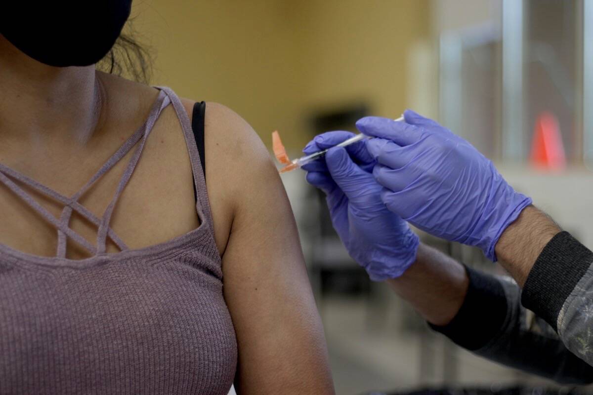 Fraser Health held a COVID-19 vaccine clinic at Gurdwara Dukh Nivaran Sahib in Surrey on May 7, 2021. A 2023 report notes that half of British Columbians are tired of having to get vaccinated. (Lauren Collins)