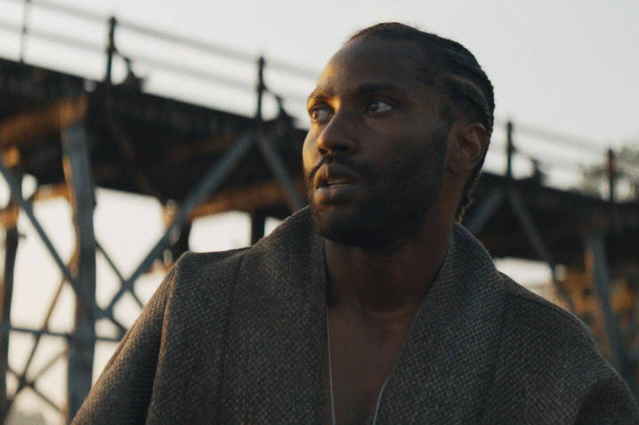 This image released by 20th Century Studios shows John David Washington in a scene from “The Creator.” (20th Century Studios via AP)