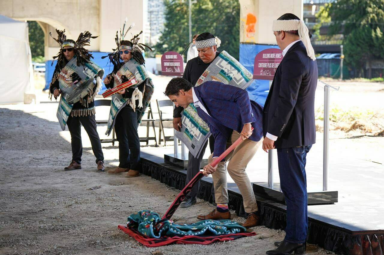 A massive Vancouver housing development spearheaded by the Squamish Nation has cleared a legal hurdle after a B.C. Supreme Court judge rejected a challenge by a residents’ association over lack of consultation. Prime Minister Justin Trudeau takes part in a groundbreaking ceremony with Squamish Nation councillors Wilson Williams, back centre, and Khelsilem, right, at the First Nation’s Senakw housing development site, in Vancouver, on Tuesday, Sept. 6, 2022. THE CANADIAN PRESS/Darryl Dyck