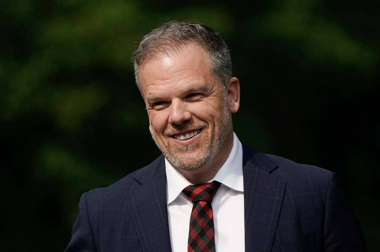 Newly appointed Health Minister Mark Holland says accountability for new federal health funding will largely come from Canadians themselves. Holland smiles as he makes his way to a cabinet shuffle, in Ottawa, Wednesday, July 26, 2023. THE CANADIAN PRESS/Adrian Wyld