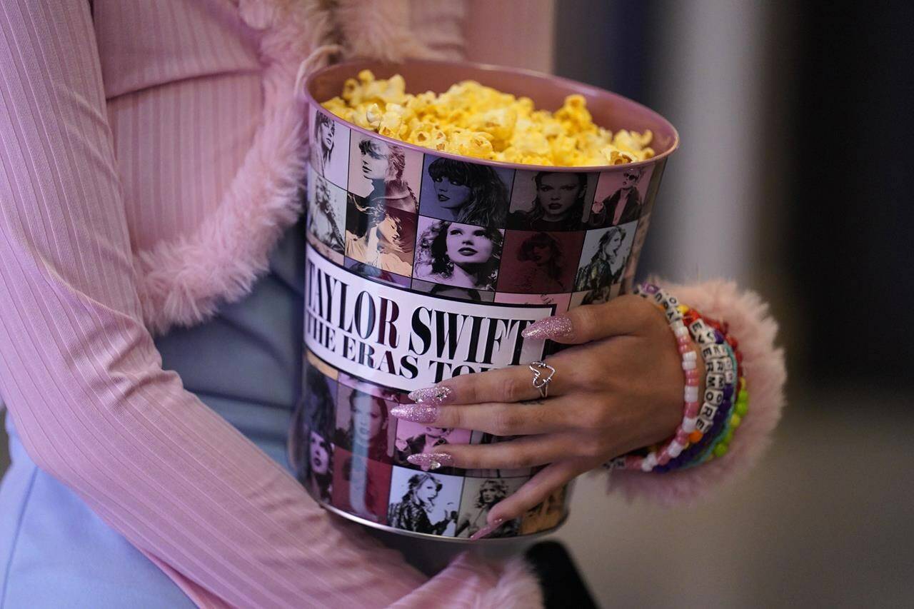 A fan attends the world premiere of the concert film “Taylor Swift: The Eras Tour” on Wednesday, Oct. 11, 2023, at AMC The Grove 14 in Los Angeles. (AP Photo/Chris Pizzello)