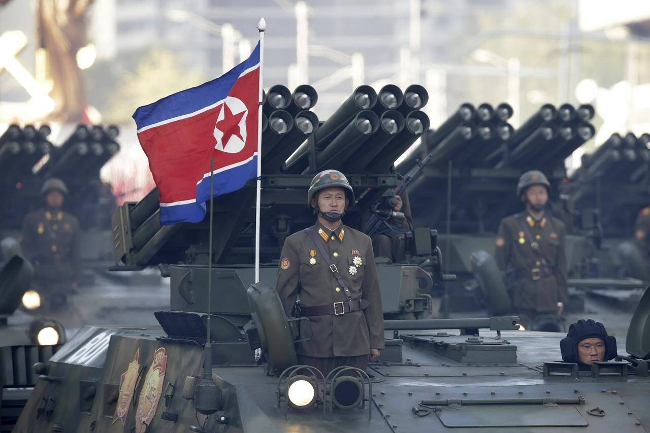 FILE - North Korean soldiers stand on armored vehicles with rocket launchers as they parade in Pyongyang, North Korea on Oct. 10, 2015. Hamas fighters likely used North Korean-manufactured rocket-propelled grenades during their unprecedented assault on Israel that killed over 1,400 people and saw scores taken hostage, despite Pyongyang denying its weapons arm the militant group. South Korean officials, two experts on North Korean arms and an Associated Press analysis of weapons captured on the battlefield by Israel point toward Hamas using Pyongyang’s F-7 rocket-propelled grenade during their Oct. 7 attack that sparked the war now raging. (AP Photo/Wong Maye-E, File)