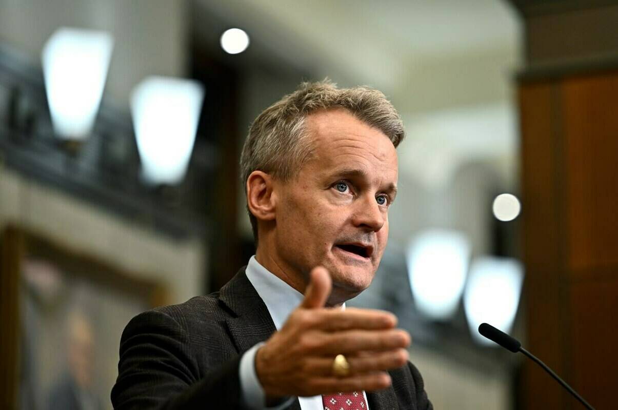 Minister of Labour and Seniors Seamus O’Regan speaks to reporters in the foyer of the House of Commons on Parliament Hill in Ottawa, on Thursday, Oct. 19, 2023. The minister says the government’s latest attempt to prevent disruptive disputes at British Columbia’s ports will lead to change this time. THE CANADIAN PRESS/Justin Tang