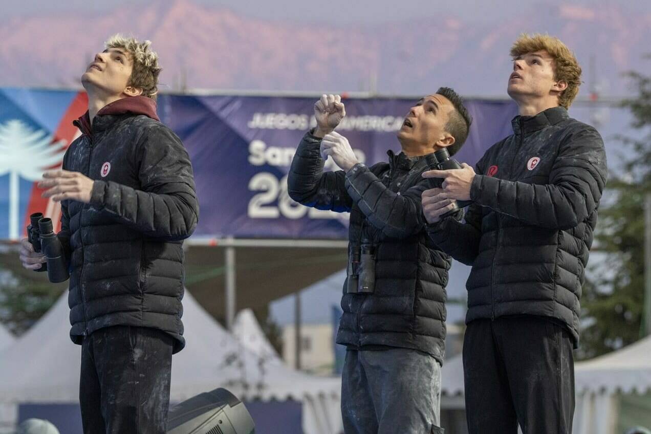 Team Canada’s Victor Baudrand, left to right, Sean McColl and Oscar Baudrand inspect the lead climb course during boulder and lead competition in Sport Climbing at the Pan American Games in Santiago, Chile on Monday Oct. 23, 2023. THE CANADIAN PRESS/Frank Gunn
