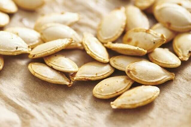 Pumpkin seeds appear on a kitchen counter in New York in 2019. (Cheyenne M. Cohen via AP)