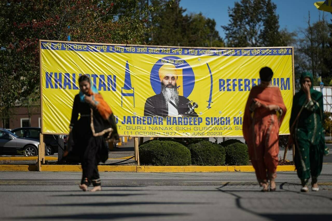 A photograph of late temple president Hardeep Singh Nijjar is seen on a banner outside the Guru Nanak Sikh Gurdwara Sahib, in Surrey, B.C., on Monday, Sept. 18, 2023. Organizers of an upcoming vote on an independent Sikh state say Canada's allegations of India's links to the killing of Nijjar have significantly bolstered vocal support for their cause. THE CANADIAN PRESS/Darryl Dyck