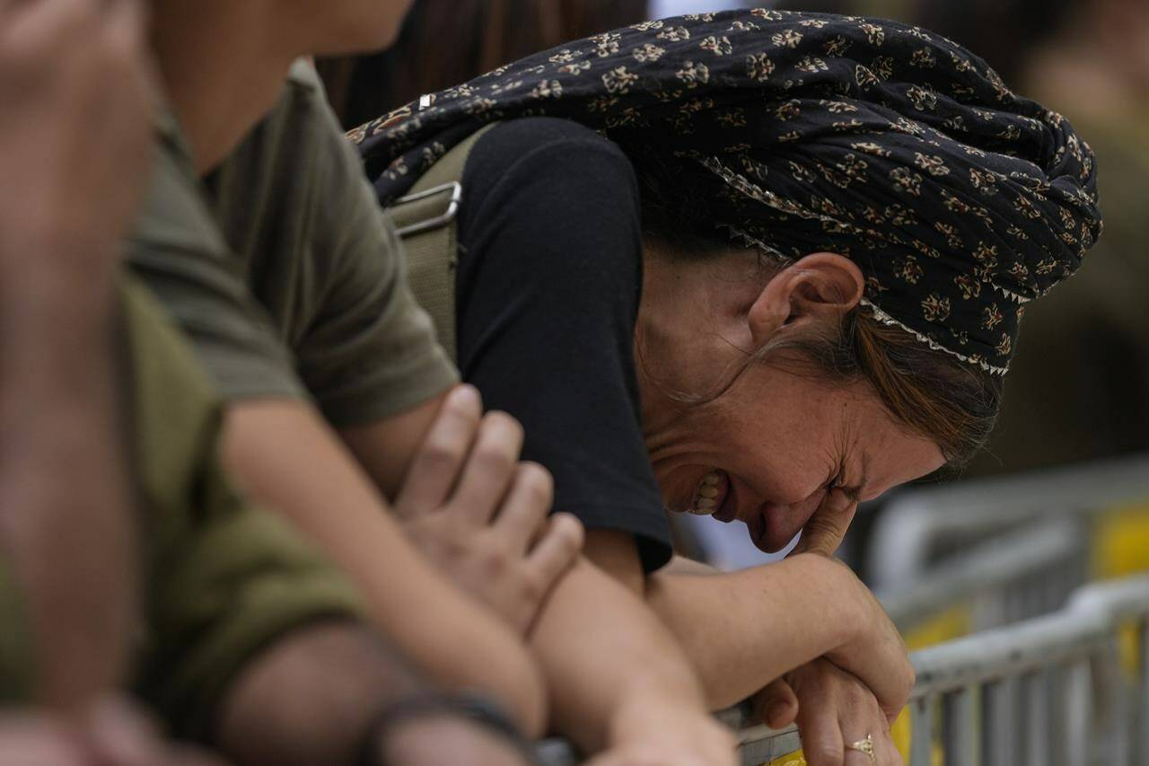 A woman cries during the funeral of Israeli Col. Roi Levy at the Mount Herzl cemetery in Jerusalem on Oct. 9, 2023. Just three weeks into the deadliest war between Israel and Hamas, it already is clear that the bloodshed has shaken the region for years to come and flipped long-standing Israeli assumptions upside down. Israelis’ sense of personal security was shattered, and the international community’s traditional approach of urging Israel to withdraw from occupied land in exchange for peace appears out of the question. (AP Photo/Maya Alleruzzo, File)