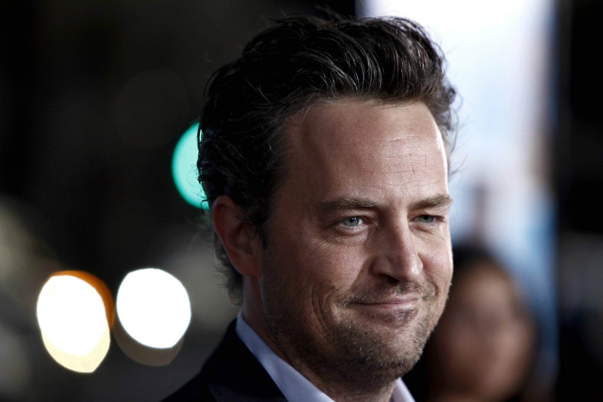 FILE - Matthew Perry arrives at the premiere of "The Invention of Lying" in Los Angeles on Sept. 21, 2009. Perry turns 52 on Aug. 19. (AP Photo/Matt Sayles, File)