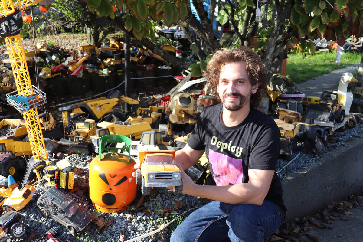 Eric Berbenuik shares his collection of Tonka trucks which adorned his Langford yard. (Photo by Tim Collins)