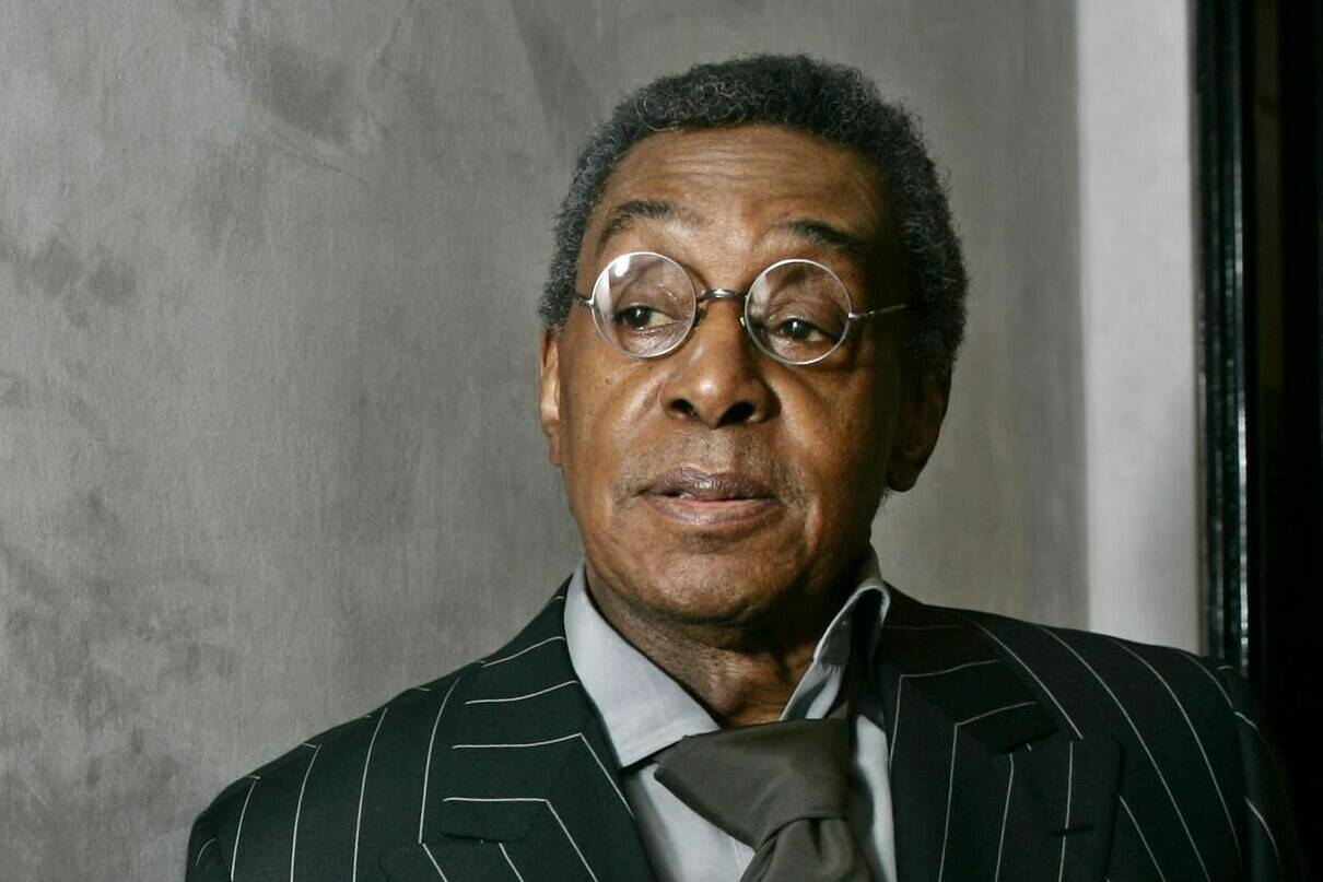 FILE - Don Cornelius poses at his Los Angeles office on March 6, 2006. The late “Soul Train” creator will be inducted into the Rock & Roll Hall of Fame on Friday night. (AP Photo/Damian Dovarganes, File)