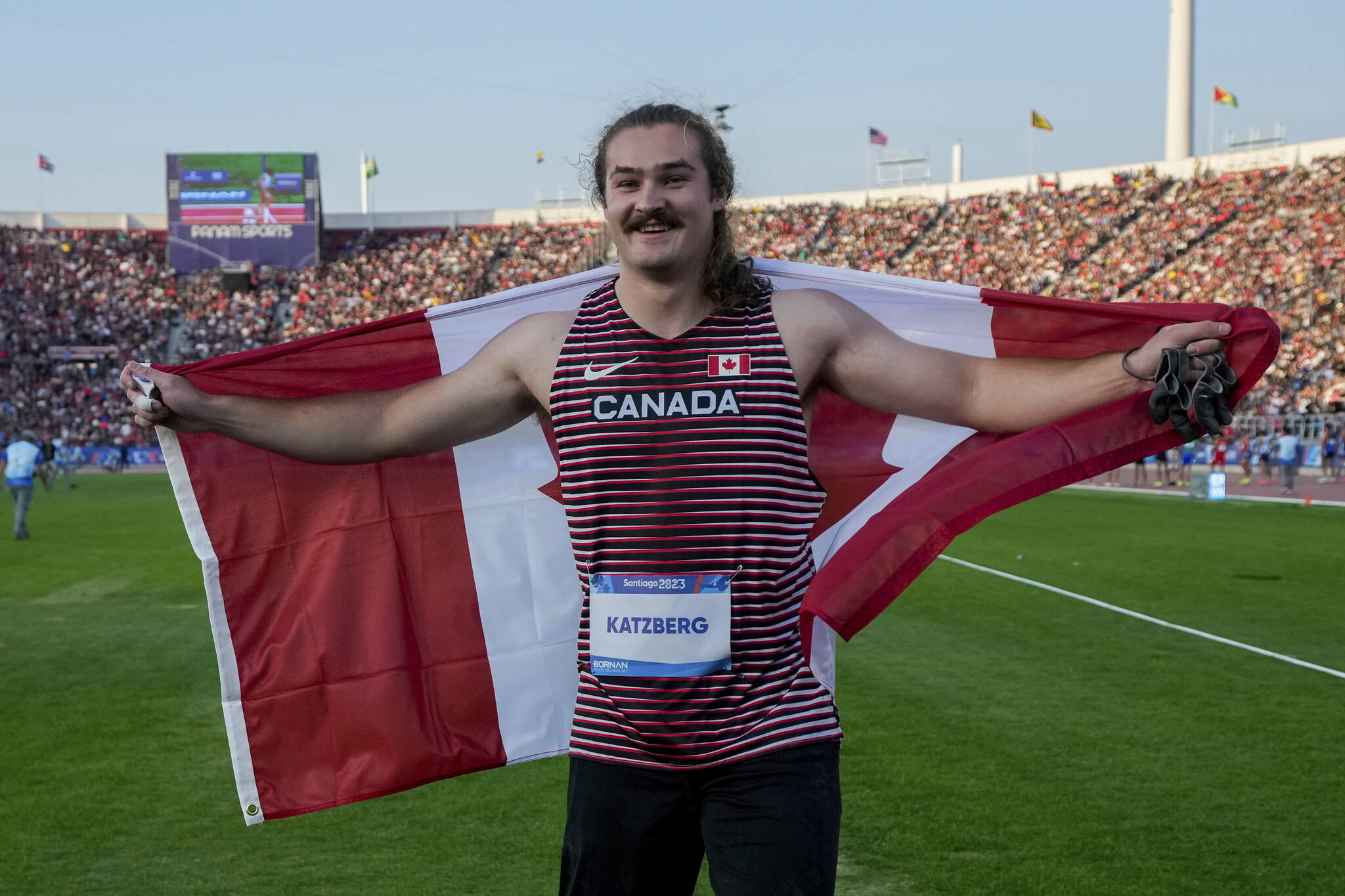 Canada’s Ethan Katzberg celebrates winning the gold medal setting a new Pan American record in the men’s hammer throw final at the Pan American Games in Santiago, Chile, Saturday, Nov. 4, 2023. (AP Photo/Martin Mejia)