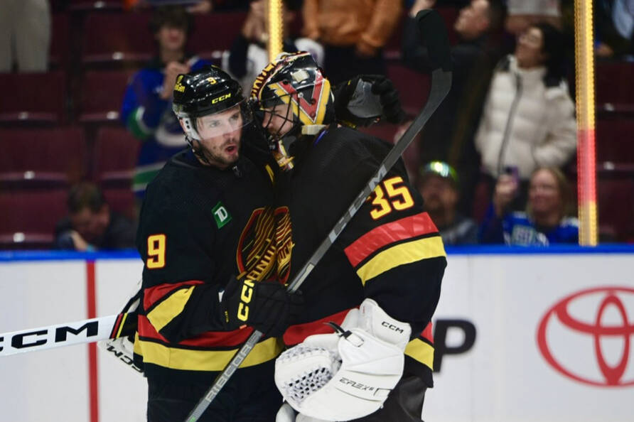 Vancouver Canucks goaltender Thatcher Demko celebrates the Canucks 6-2 win over the Edmonton Oilers at Rogers Arena Monday night with teammate J.T. Miller. Photo courtesy Vancouver Canucks