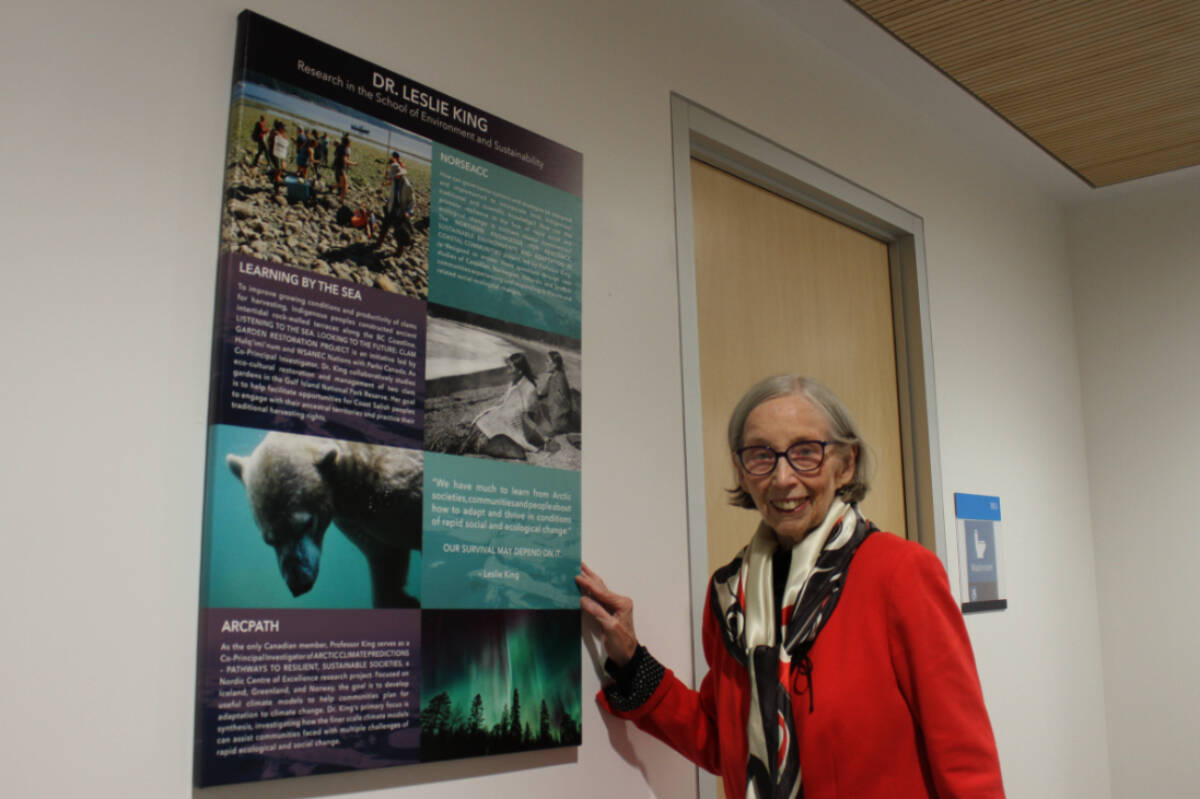 Environmental and sustainability Prof. Leslie King at Royal Road University stands beside the poster she created. (Ella Matte/New Staff)