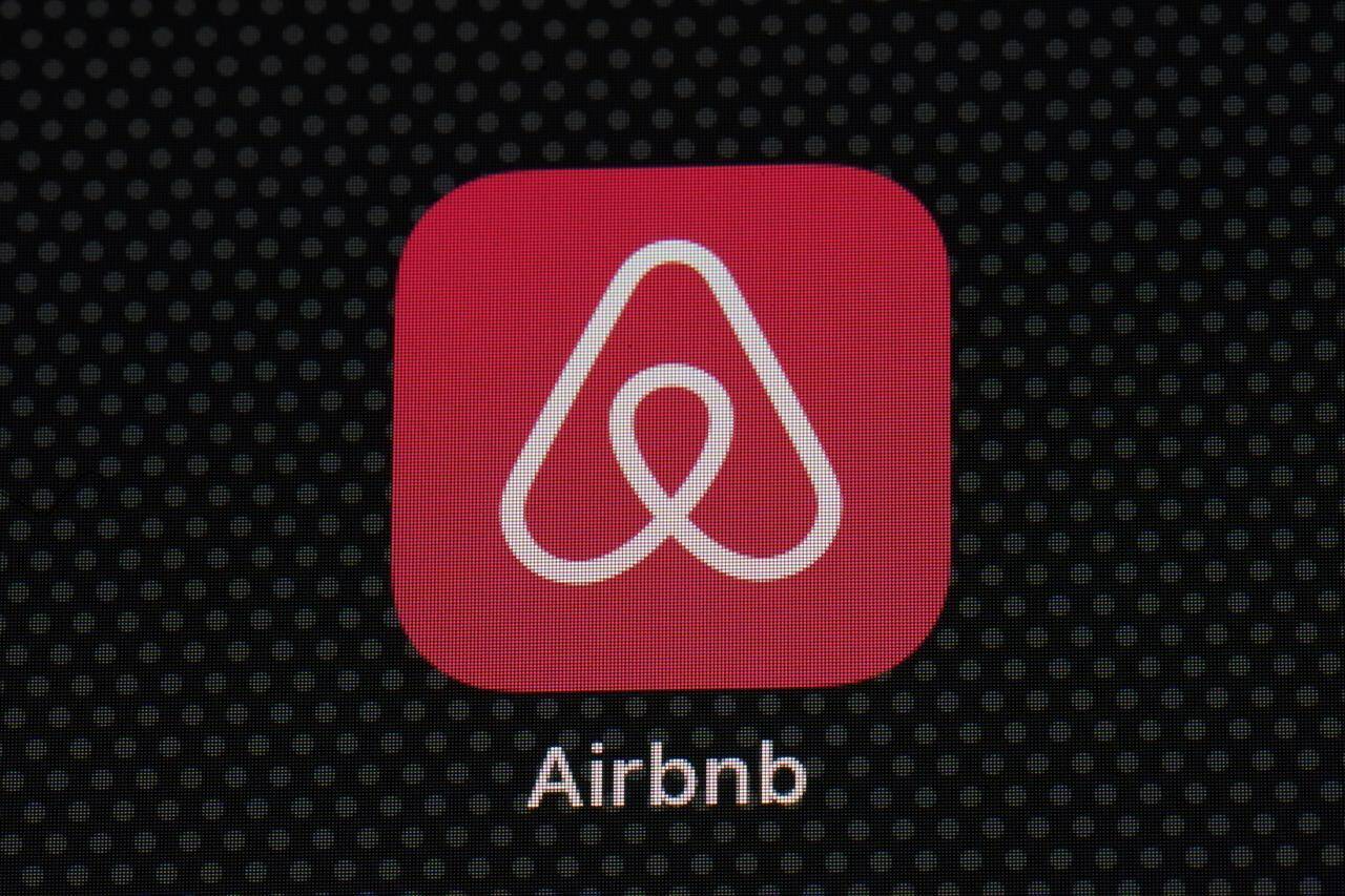 FILE - The Airbnb app icon is displayed on an iPad screen in Washington, D.C., on May 8, 2021. Airbnb reports earnings on Wednesday, Nov. 1, 2023. (AP Photo/Patrick Semansky, File)