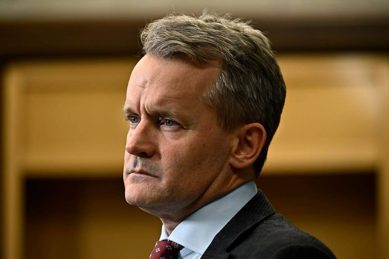 Minister of Labour Seamus O'Regan listens to a question from a reporter in the in the Foyer of the House of Commons on Parliament Hill in Ottawa, on Thursday, Oct. 19, 2023. Replacement workers will be banned during strikes and lockouts at federally regulated workplaces under new legislation introduced in the House of Commons today. THE CANADIAN PRESS/Justin Tang
