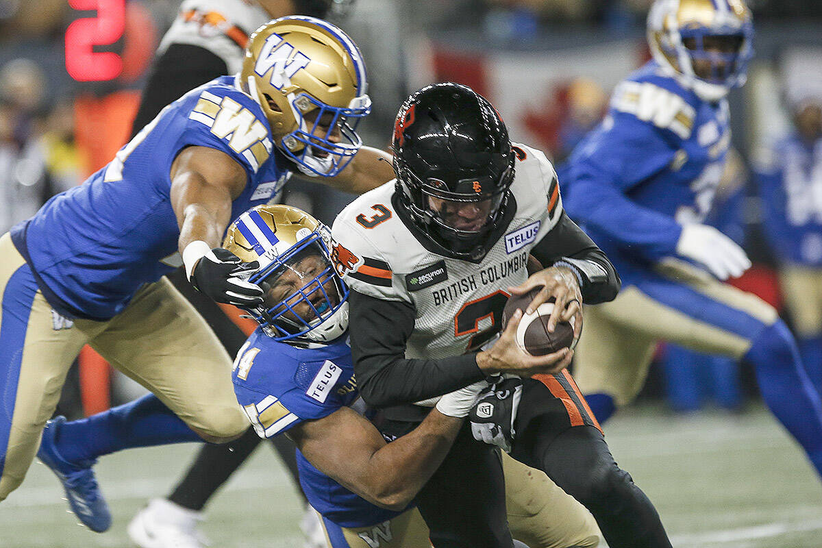 Winnipeg Blue Bombers’ Jackson Jeffcoat (94) sacks B.C. Lions quarterback Vernon Adams Jr. (3) during first half CFL action in Winnipeg Saturday, November 11, 2023. THE CANADIAN PRESS/John Woods