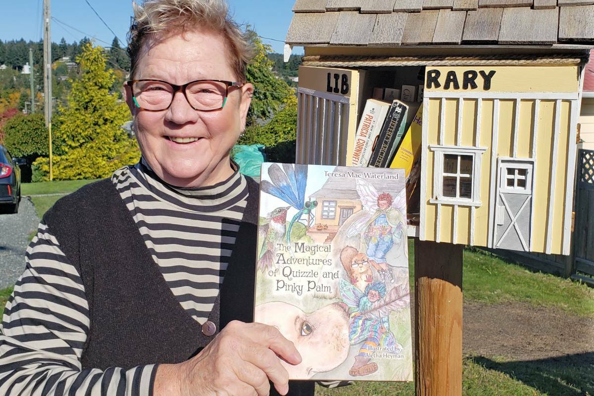 Teresa Waterland drops off a copy of her self-published book, ‘The Magical Adventures of Quizzle and Pinky Palm,’ in a little neighbourhood library in Nanaimo. (Submitted photo)