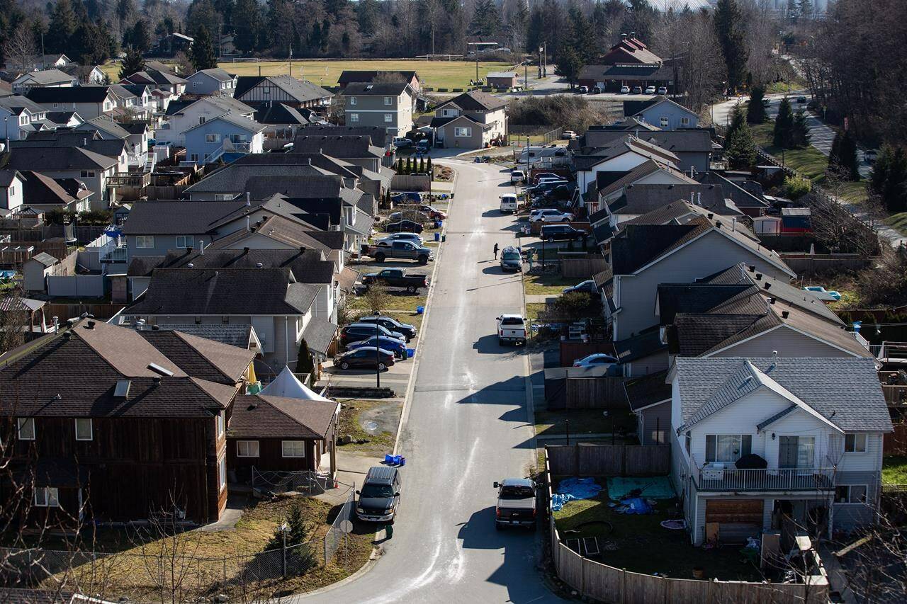 A new report from the Canada Mortgage and Housing Corporation says that although seniors tend to consider downsizing as they age, a large proportion are instead choosing to age in their home rather than put it on the market. Houses are seen on Squamish Nation land in North Vancouver, B.C., Tuesday, Feb. 22, 2022. THE CANADIAN PRESS/Darryl Dyck