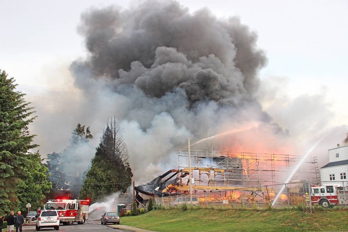 Fire crews fight the massive blaze that swept through White Rock’s Five Corners district on May 15, 2016. (File photo)