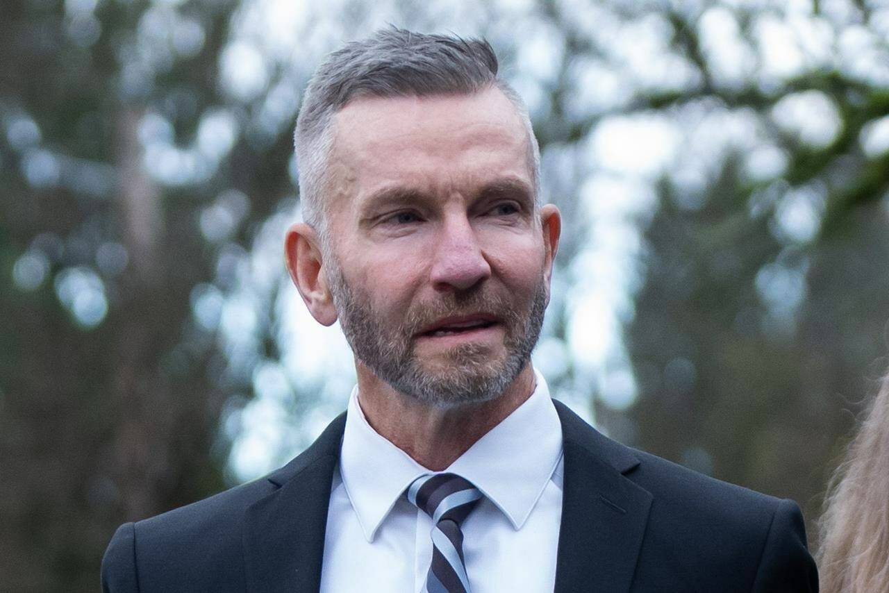 Warrant Officer James Topp leaves the Royal Westminster Regiment during an adjournment during his court martial in New Westminster, B.C., Tuesday, Nov. 14, 2023. THE CANADIAN PRESS/Ethan Cairns