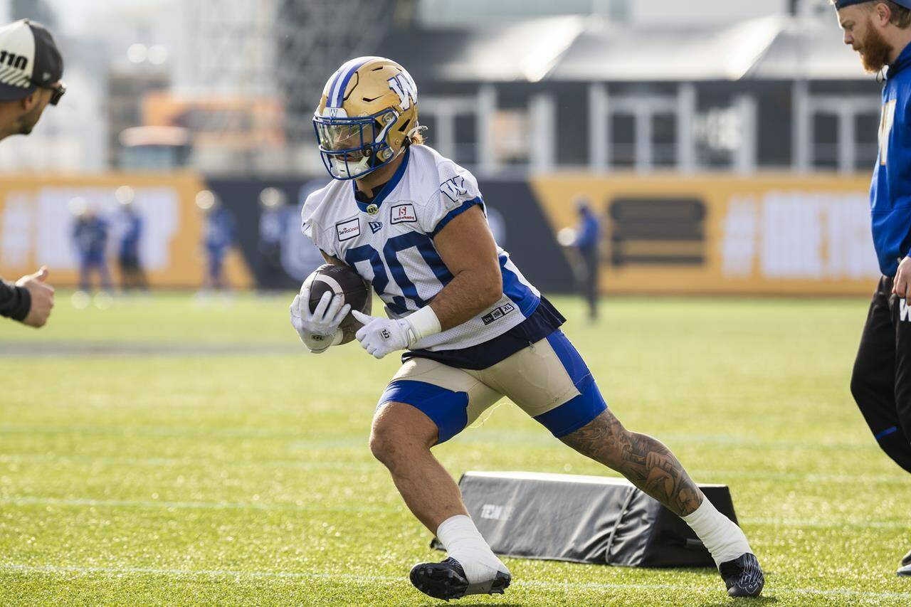 Winnipeg Blue Bombers running back Brady Oliveira (20) participates in a drill during practice in Hamilton on Thursday, Nov. 16, 2023. Oliveira will be a key figure Sunday. The five-foot-10, 222-pound running back ran for a league-best 1,534 yards in capturing the CFL’s top Canadian award. He accumulated 238 of those yards in leading the Blue Bombers to a 2-0 regular-season sweep of the Montreal Alouettes. THE CANADIAN PRESS/Nick Iwanyshyn