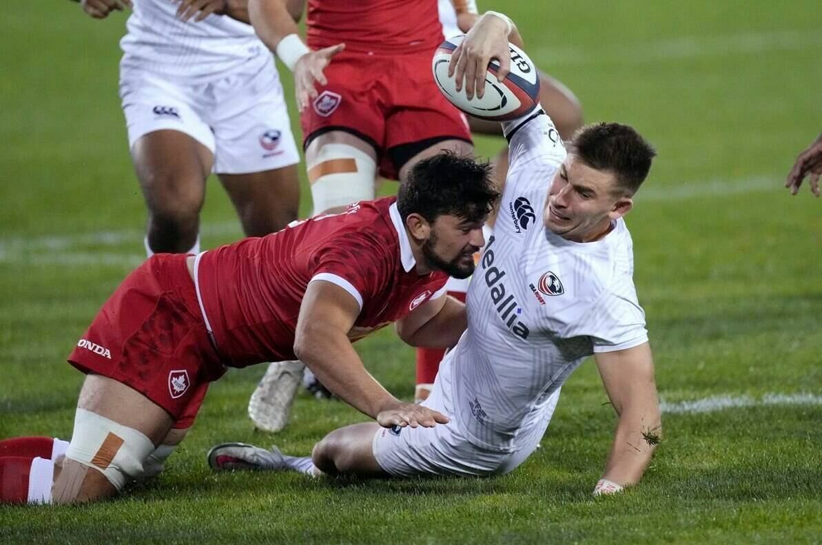 Canada’s Lucas Rumball, left, tackles U.S. wing Christian Dyer during the first half of a Rugby World Cup 2023 qualification pathway match Saturday, Sept. 11, 2021, in Glendale, Colo. Rumball scored three tries Saturday as Canada defeated Brazil 40-15 to finish third at the four-team La Vila International Rugby Cup. THE CANADIAN PRESS/AP/David Zalubowski
