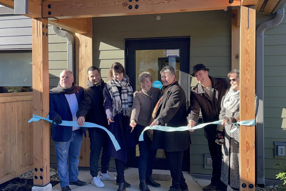 Ellen Frood, third from right, and Chris Alemany, second from right, of Sage Haven Society, are joined by community leaders to officially open Wiiksahiqu?il, Sage Haven’s new second stage housing complex. (SUSAN QUINN/ Alberni Valley News)