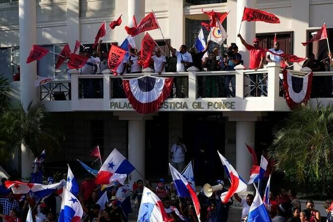 Protesters celebrate as they learn that Panama's Supreme Court has declared unconstitutional a 20-year concession for a Canadian copper mine that had sparked weeks of protests, in Panama City, Tuesday, Nov. 28, 2023. (AP Photo/Arnulfo Franco)