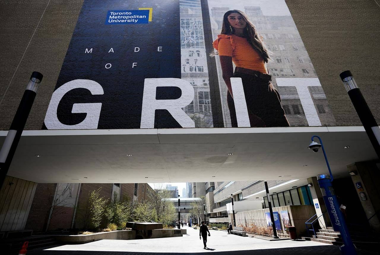 A new survey suggests one in four Canadians believe a university degree is essential to succeed economically. Students make their way around the Toronto Metropolitan University in Toronto on Wednesday, April 26, 2023. THE CANADIAN PRESS/Nathan Denette