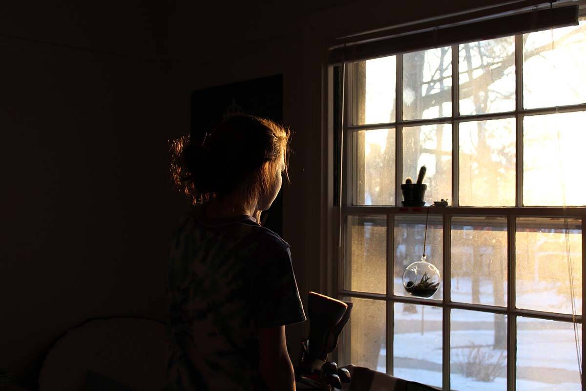Overall, 65 per cent of Canadians know a woman who has faced abuse. But broken down by gender, 69 per cent of women surveyed know a woman who has experienced assault, compared to 61 per cent of men. Woman staring out window. (Pixabay)