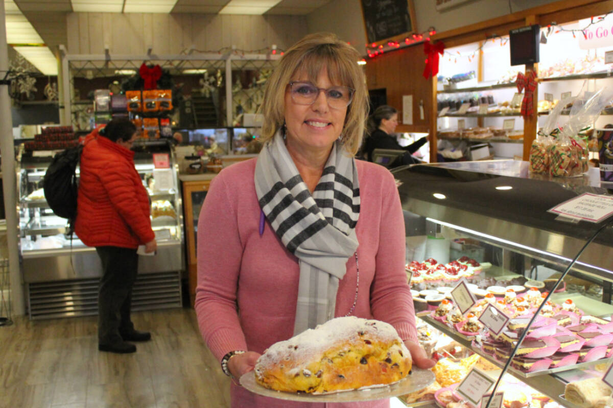 Michele Brynes, third-generation co-owner of the Dutch Bakery holds stollen that is a traditional holiday classic. (Ella Matte/News Staff)