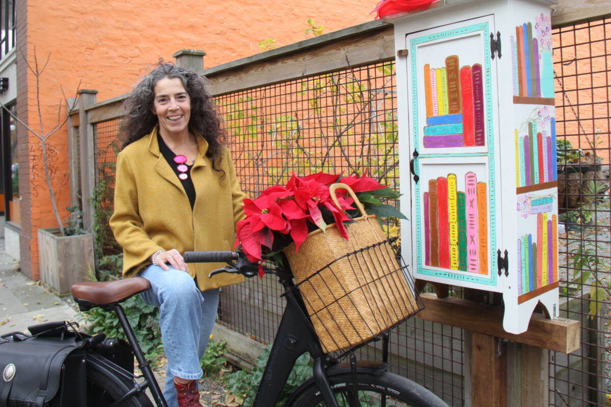Angela Gabaldon is The Artful Peddler – particularly popular online for her Urban Jewels collection of images showcasing beauty around Victoria. She’s also the artist who created this little free library look. (Christine van Reeuwyk/News Staff)
