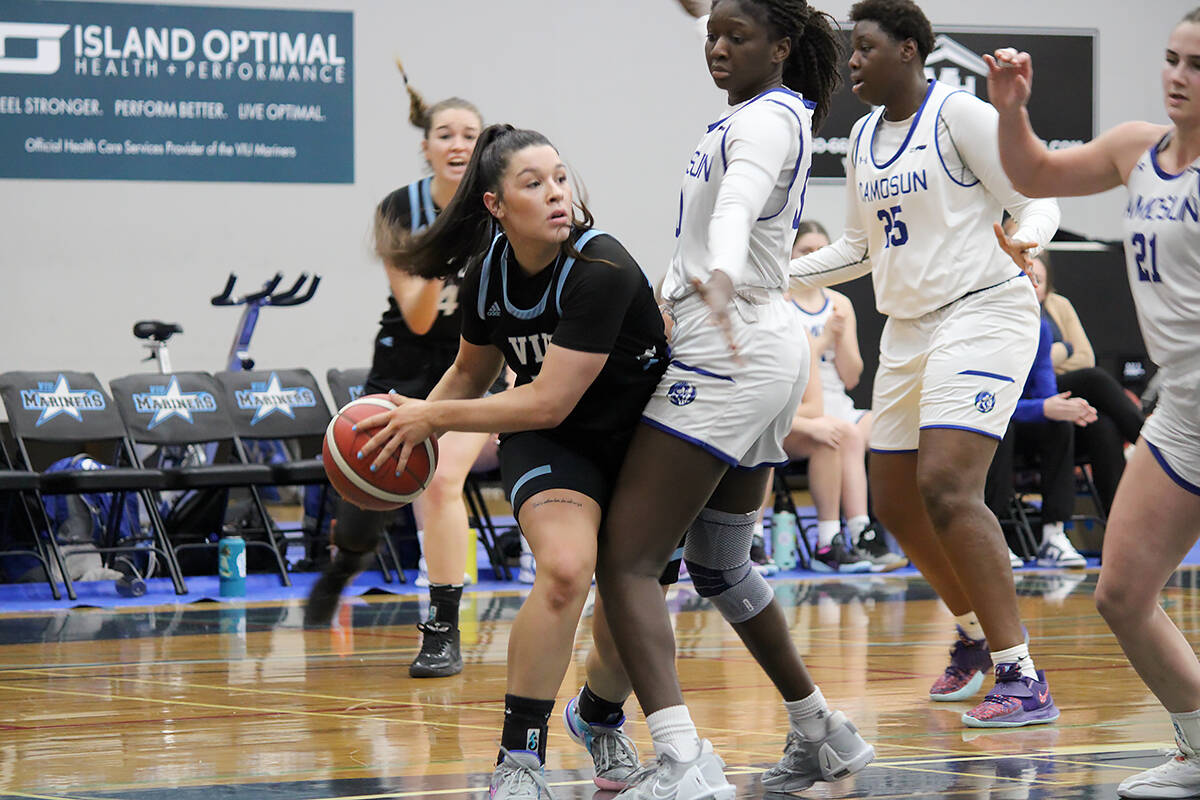 VIU Mariners player Katelynn Forner looks to pass the ball during a PacWest game against the Camosun Chargers at the Vancouver Island University gym last month. (Karl Yu/News Bulletin)