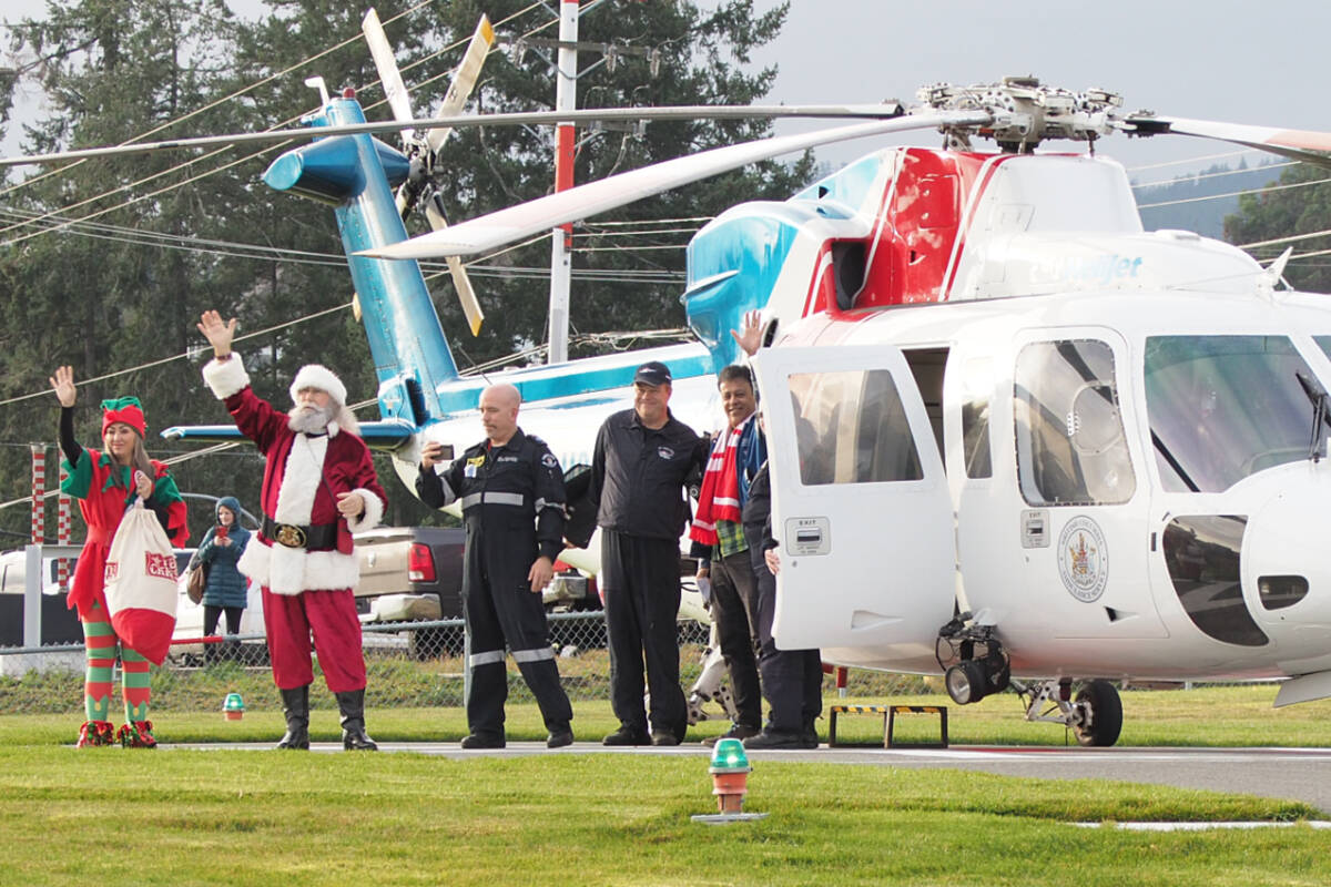 Santa and his entourage make their 19th annual flight aboard a Helijet air ambulance to cheer up sick children at Nanaimo Regional General Hospital on Tuesday, Dec. 12. (Chris Bush/News Bulletin)