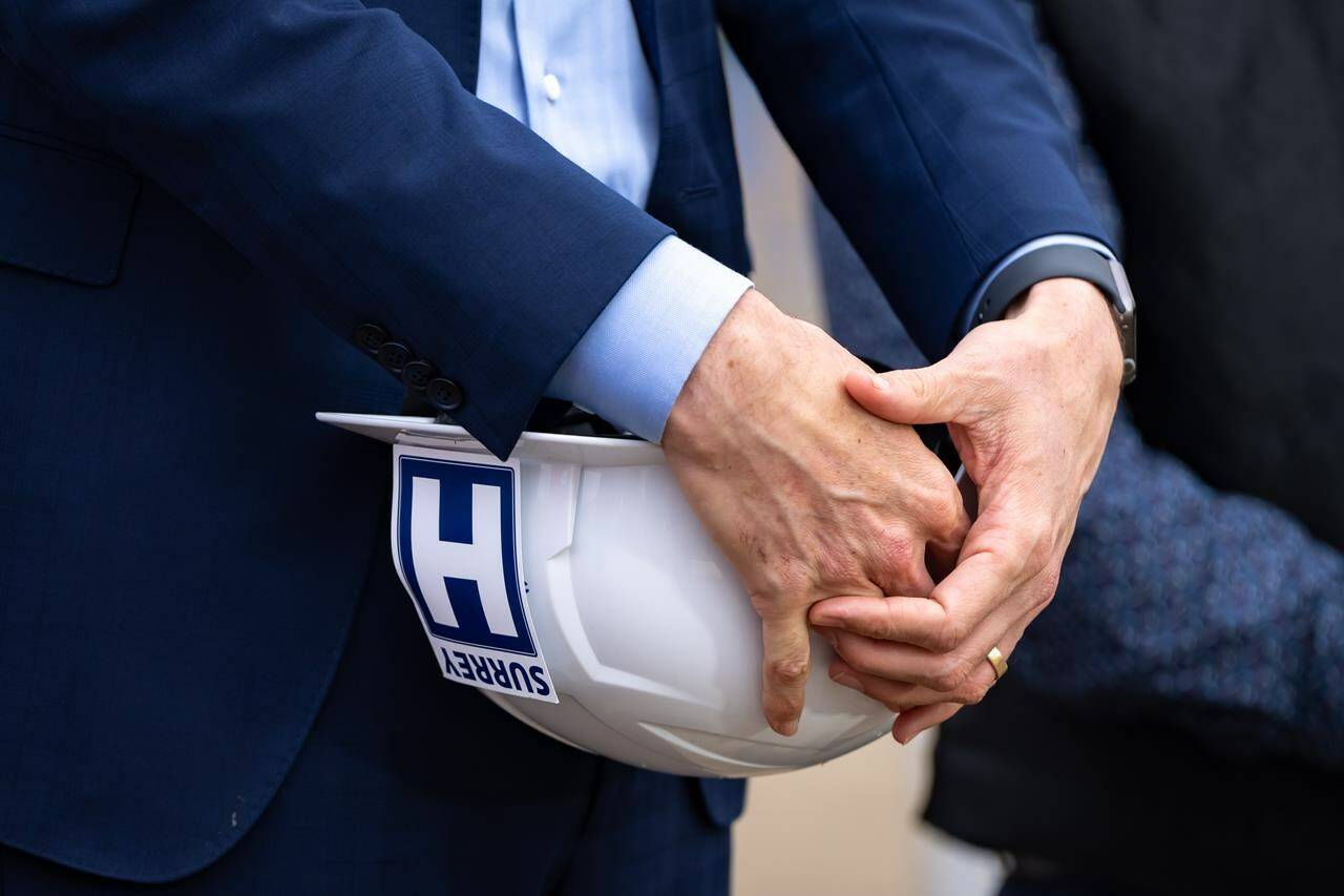 British Columbia’s provincial government says it is going ahead with the construction of a “state-of-the-art” research centre at the new St. Paul’s Hospital in Vancouver. B.C. Premier David Eby holds a hard hat with a hospital sign affixed during an announcement in Surrey, B.C., Tuesday, Sept. 12, 2023. THE CANADIAN PRESS/Ethan Cairns